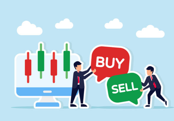 Two businessmen next to a monitor showing candlestick stock char