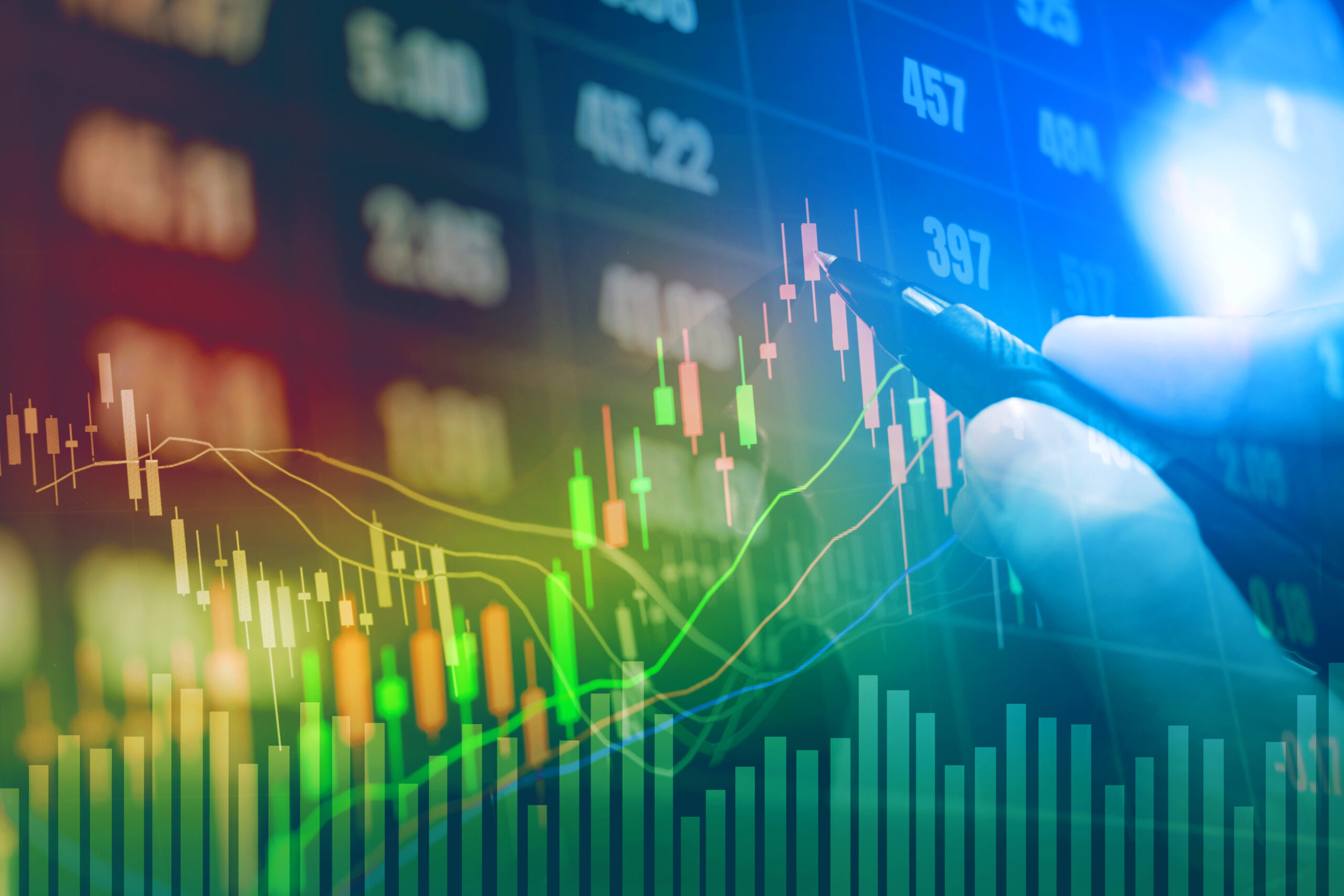 Businessman writing the trading graph of stock market on digital